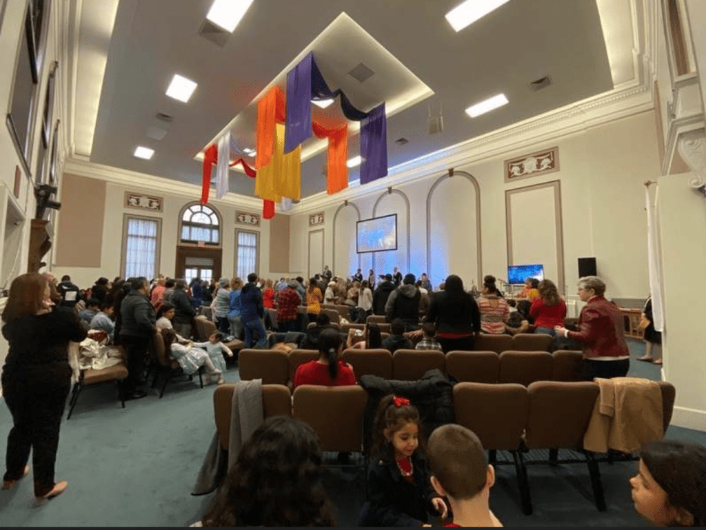 People in church in New London